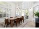 Elegant dining room features a wooden table and access to backyard at 10413 N 118Th Pl, Scottsdale, AZ 85259