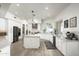 Modern kitchen with white cabinets and marble countertops at 10413 N 118Th Pl, Scottsdale, AZ 85259