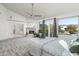 Main bedroom with a fireplace and access to the bathroom and private balcony at 10413 N 118Th Pl, Scottsdale, AZ 85259