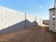 A view of the perimeter block wall in the backyard at 16038 W Desert Hollow Dr, Surprise, AZ 85387