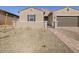 Charming single-story home with a two-car garage, secure gated entrance, and desert landscaping at 17672 W Pierson St, Goodyear, AZ 85395