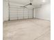 Spacious, clean garage with a sealed concrete floor and an insulated roll-up door at 17672 W Pierson St, Goodyear, AZ 85395