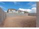 Empty lot with block wall and view of neighboring houses under construction at 18350 W Poston Dr, Surprise, AZ 85387