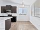 Bright kitchen features dark cabinets, a breakfast nook, and a view at 27112 N 148Th Dr, Surprise, AZ 85387