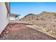 Covered patio with brick pavers overlooks desert landscape at 27112 N 148Th Dr, Surprise, AZ 85387