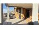 Covered front porch with seating area and entrance to home at 3155 S 127Th Ave, Avondale, AZ 85323