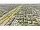 Wide aerial shot pinpointing a well-maintained neighborhood with desert landscaping and green spaces at 43205 W Askew Dr, Maricopa, AZ 85138