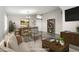 Bright dining room featuring a table, chairs, and built-in shelving at 43205 W Askew Dr, Maricopa, AZ 85138