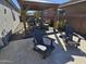 Beautiful backyard with pergola, comfortable seating, and outdoor dining area at 926 W Ayrshire Trl, San Tan Valley, AZ 85143