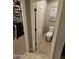 A view into the bathroom featuring neutral tiling, paint and trim and a white toilet at 926 W Ayrshire Trl, San Tan Valley, AZ 85143