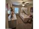 Bright bedroom showcasing a decorative canopy bed, dresser, and natural light through the window at 926 W Ayrshire Trl, San Tan Valley, AZ 85143