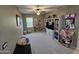 Cozy bedroom with neutral walls, carpet and built-in storage perfect for children or teens at 926 W Ayrshire Trl, San Tan Valley, AZ 85143