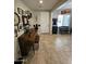 Inviting entryway with a piano, decorative wall art, and bench seating next to a large window at 926 W Ayrshire Trl, San Tan Valley, AZ 85143