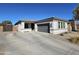 Charming single-story home with a well-maintained front yard, a two-car garage, and a welcoming entrance at 926 W Ayrshire Trl, San Tan Valley, AZ 85143