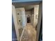 Hallway view of a shower with white tile and glass enclosure, leading to a walk-in closet at 926 W Ayrshire Trl, San Tan Valley, AZ 85143