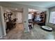 View of the hallway connecting the rooms featuring decor elements, access to living room and office space at 926 W Ayrshire Trl, San Tan Valley, AZ 85143