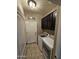 Well-equipped laundry room featuring modern washer, dryer, and dark wood storage cabinets at 926 W Ayrshire Trl, San Tan Valley, AZ 85143