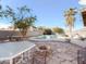 Inviting backyard with a refreshing pool, patio furniture, and fire pit at 1342 N Mckenna Ln, Gilbert, AZ 85233