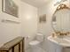 Clean bathroom with an ornate mirror and pedestal sink at 1342 N Mckenna Ln, Gilbert, AZ 85233