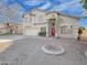 Two-story house with a red door and fire pit at 1342 N Mckenna Ln, Gilbert, AZ 85233