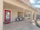 Covered patio with seating area and access to backyard at 1342 N Mckenna Ln, Gilbert, AZ 85233