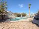 Large kidney shaped pool with flagstone decking and built in BBQ at 1342 N Mckenna Ln, Gilbert, AZ 85233