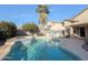 Expansive pool area with built-in spa and outdoor kitchen at 1342 N Mckenna Ln, Gilbert, AZ 85233