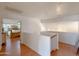 Upstairs hallway leading to bedrooms with wooden floors at 1342 N Mckenna Ln, Gilbert, AZ 85233