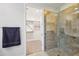 Bathroom with walk-in shower and access to a large closet at 4360 N 186Th Ln, Goodyear, AZ 85395