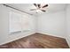 Light and airy bedroom with hardwood floors and window blinds at 4360 N 186Th Ln, Goodyear, AZ 85395