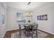 Dining room with chandelier and table set for four at 4360 N 186Th Ln, Goodyear, AZ 85395