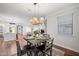 Bright dining room with a view into the kitchen at 4360 N 186Th Ln, Goodyear, AZ 85395