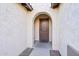 Front entry with arched doorway and neutral-colored walls at 4360 N 186Th Ln, Goodyear, AZ 85395