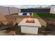 Modern fire pit surrounded by comfortable seating at 4360 N 186Th Ln, Goodyear, AZ 85395