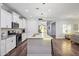 Modern kitchen with white cabinets, granite counters, and stainless steel appliances at 4360 N 186Th Ln, Goodyear, AZ 85395