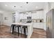 Modern kitchen with white cabinets and large island at 4360 N 186Th Ln, Goodyear, AZ 85395