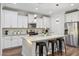 Modern kitchen with white cabinets and stainless steel appliances at 4360 N 186Th Ln, Goodyear, AZ 85395