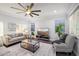 Living room with ceiling fan and comfortable seating at 4360 N 186Th Ln, Goodyear, AZ 85395