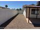 Backyard with white fence and partial shade from patio and desert landscaping at 5232 E Dodge St, Mesa, AZ 85205