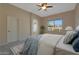 Inviting main bedroom with a ceiling fan, neutral walls, plush carpet, and lots of natural light at 6520 W Oraibi Dr, Glendale, AZ 85308