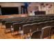 Large auditorium with rows of chairs facing a stage, suitable for events and performances at 17200 W Bell Rd # 1015, Surprise, AZ 85374