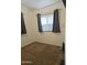 Bright bedroom featuring carpeted flooring and window treatments at 17200 W Bell Rd # 1015, Surprise, AZ 85374