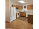 Bright kitchen featuring wood cabinets and a white refrigerator at 17200 W Bell Rd # 1015, Surprise, AZ 85374