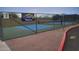 Outdoor pickleball courts with blue playing surface and chain-link fence, perfect for recreation at 17200 W Bell Rd # 1015, Surprise, AZ 85374