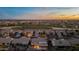 Community overview showcasing homes, golf course, and distant city lights at 8546 E Brittle Bush Rd, Gold Canyon, AZ 85118