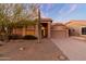 One-story home with front yard landscaping and a two-car garage at 8546 E Brittle Bush Rd, Gold Canyon, AZ 85118