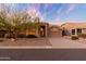 Single-story home with desert landscaping and a two-car garage at 8546 E Brittle Bush Rd, Gold Canyon, AZ 85118