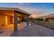 Covered patio with pavers and ceiling fan, offering an outdoor living space at 8546 E Brittle Bush Rd, Gold Canyon, AZ 85118