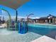 Community pool with a splash pad and lounge chairs at 3650 E Alexander Dr, San Tan Valley, AZ 85143