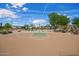 Well-maintained community basketball court set in lush green surroundings provides a great space for sports and recreation at 10101 E Posada Ave, Mesa, AZ 85212
